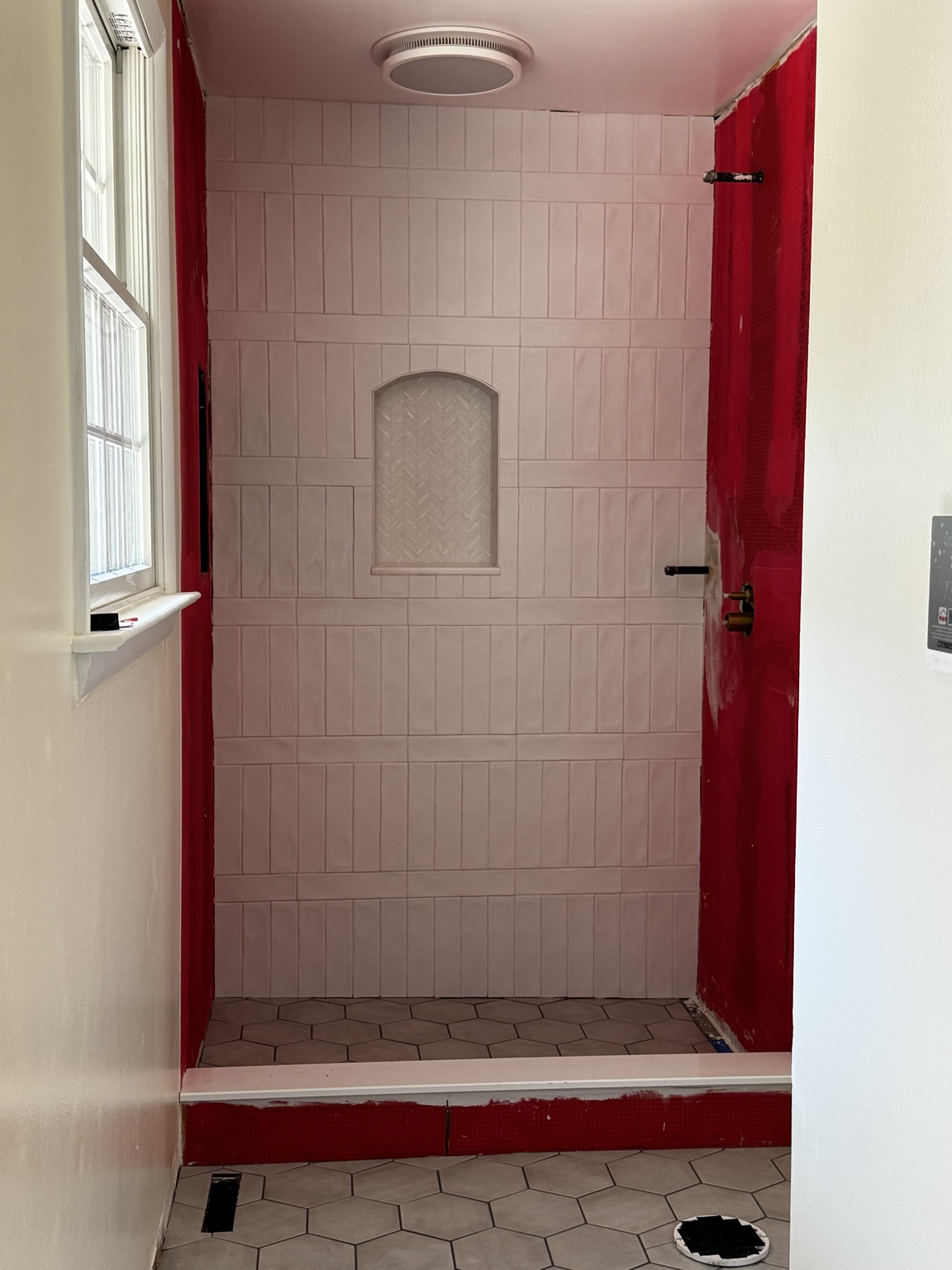 Custom shower tile installation in progress